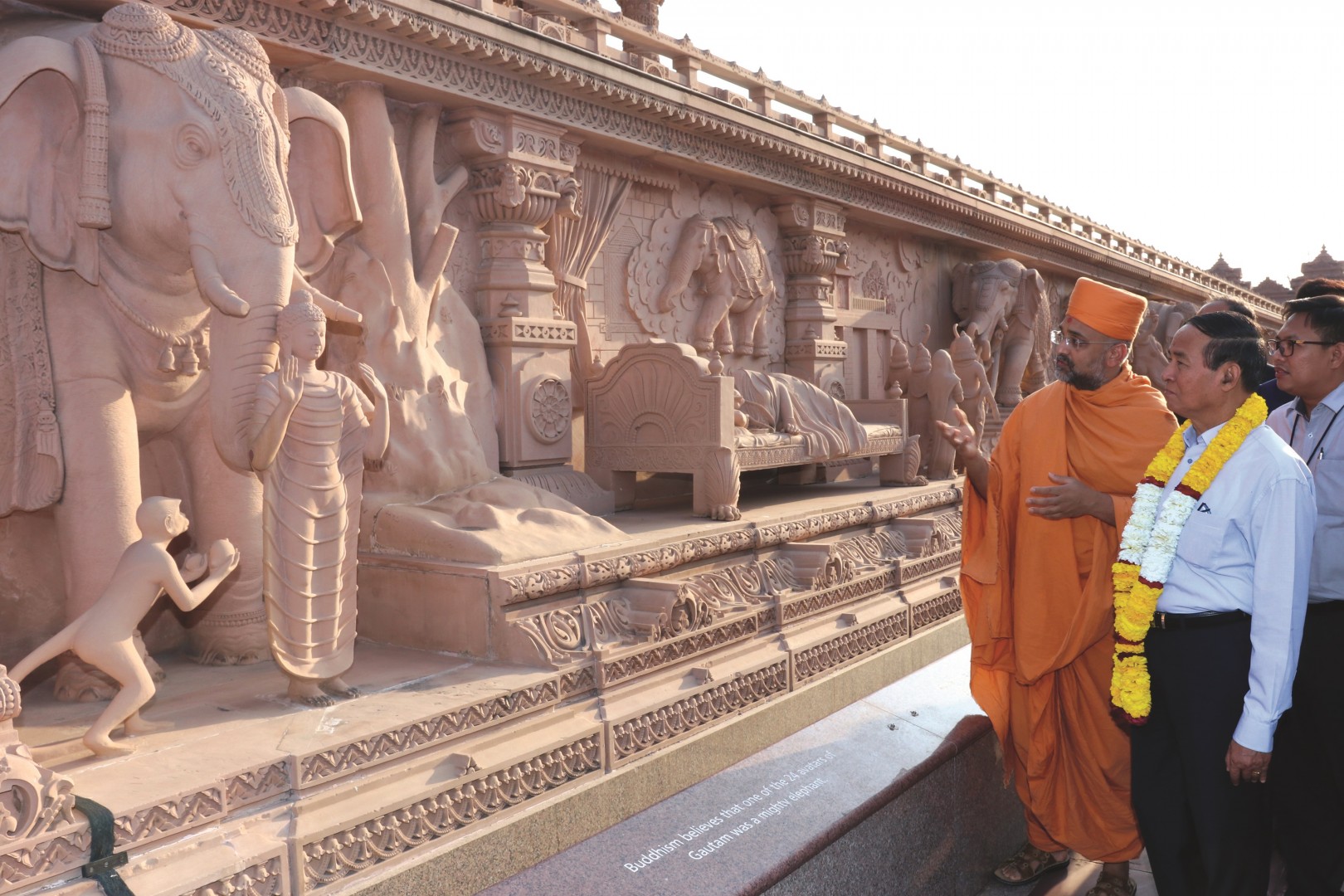 While viewing the Gajendra Pithika (Elephant Plinth), President Win Myint observes the stone carving of both Buddha and the divine symbolic dream preluding to Buddha’s birth