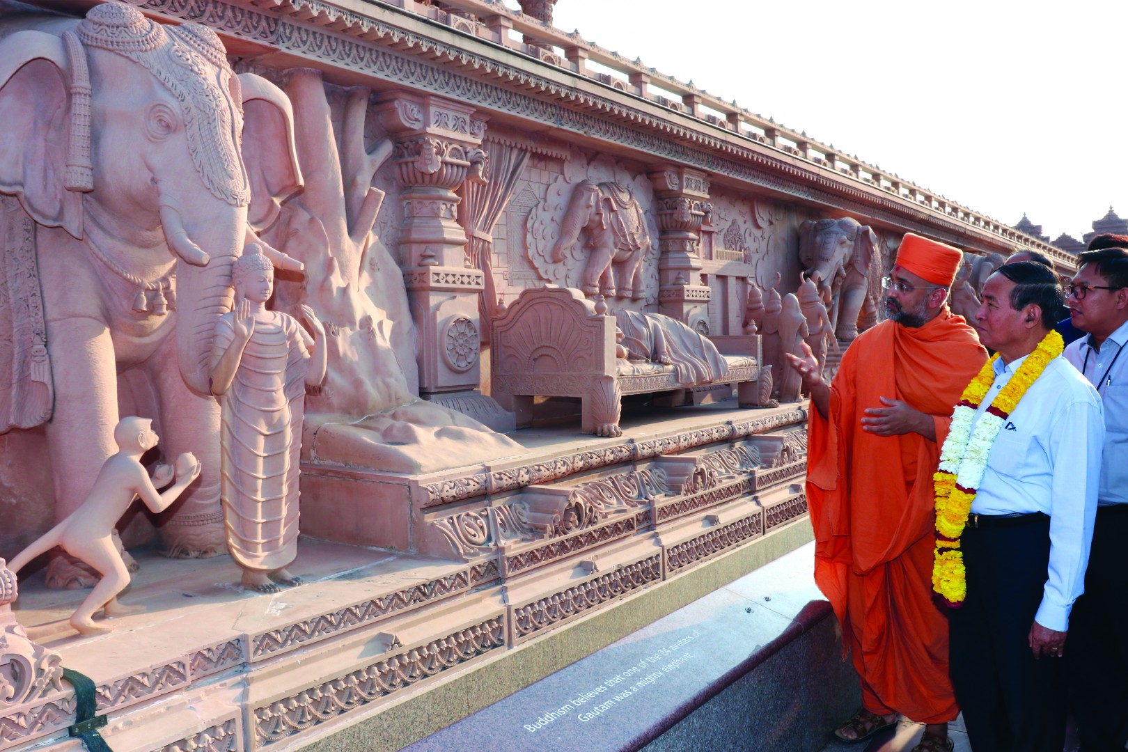 While viewing the Gajendra Pithika (Elephant Plinth), President Win Myint observes the stone carving of both Buddha and the divine symbolic dream preluding to Buddha’s birth